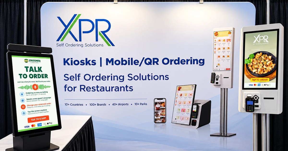 The XPR booth at FS/TEC 2026 with a countertop Talk to Order voice kiosk, a floor-standing kiosk, and the XPR Self Ordering Solutions backdrop